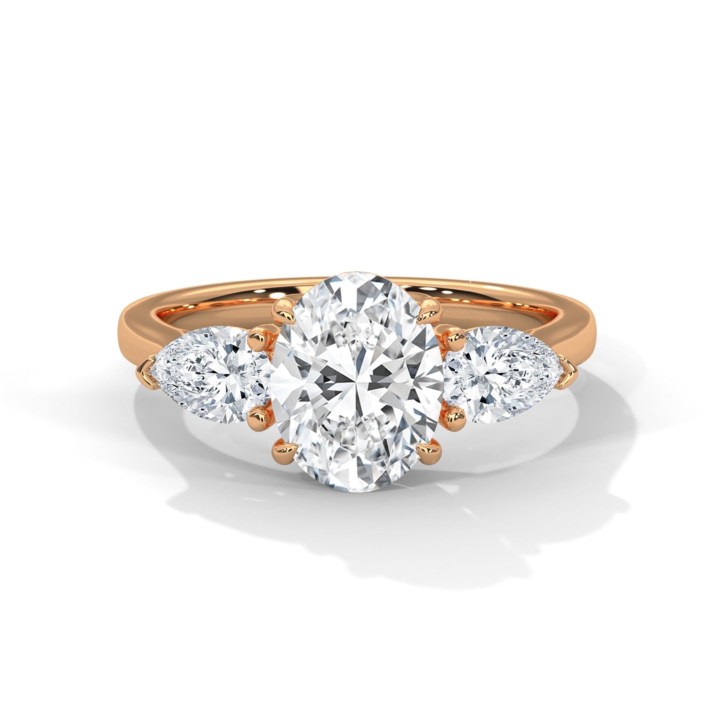 elegant oval-cut three-stone diamond engagement ring with pear side stones