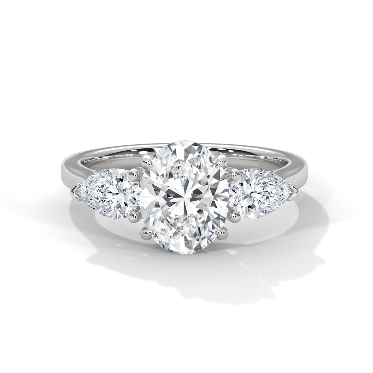 elegant oval-cut three-stone diamond engagement ring with pear side stones