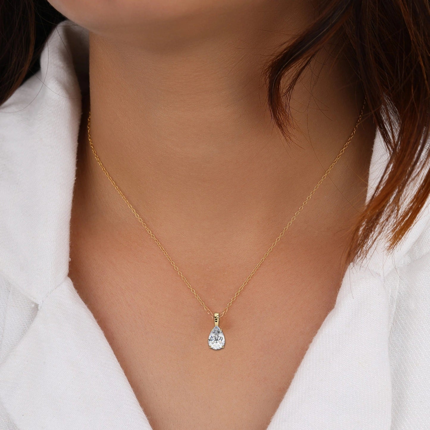 featuring a beautiful teardrop-shaped pendant that adds elegance to any outfit